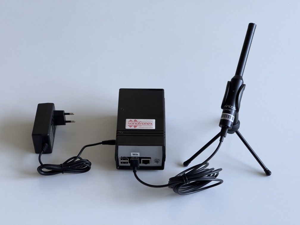 Noise-monitoring kit on a desk
